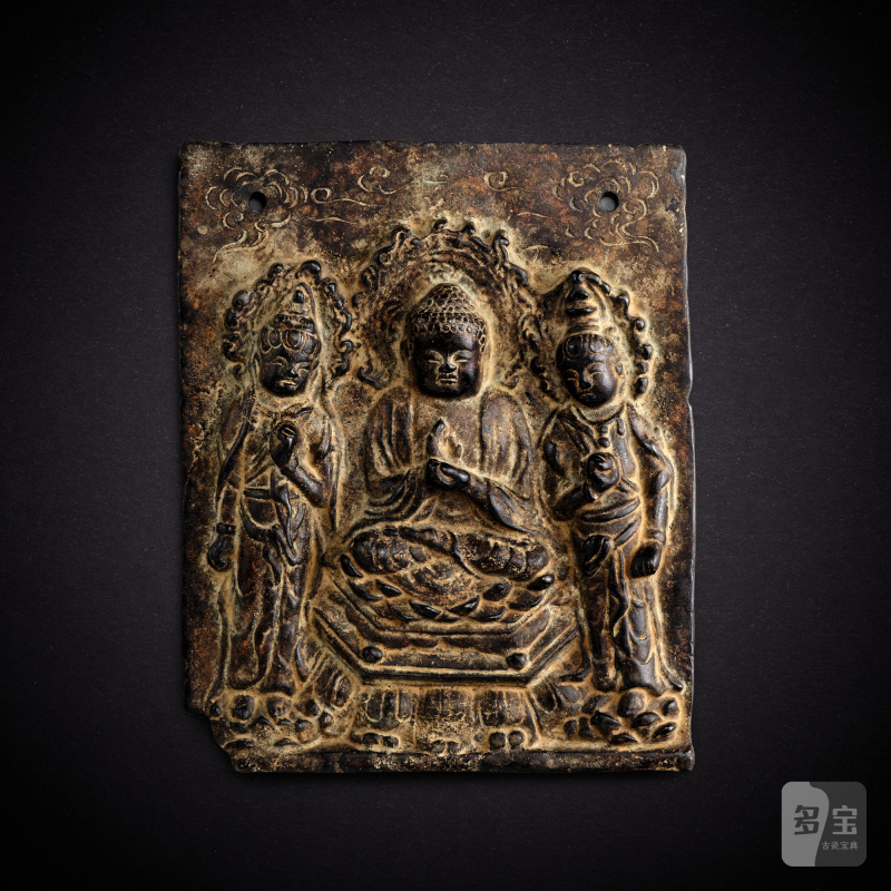 A bronze repoussé 'Buddhist triad' plaque, Tang dynasty | 唐 銅錘鍱釋迦三尊像牌